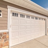 Cream colored garage door after service